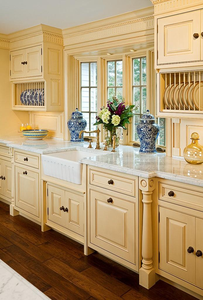 Butter yellow and cream kitchen interior with elegant modern cabinetry
