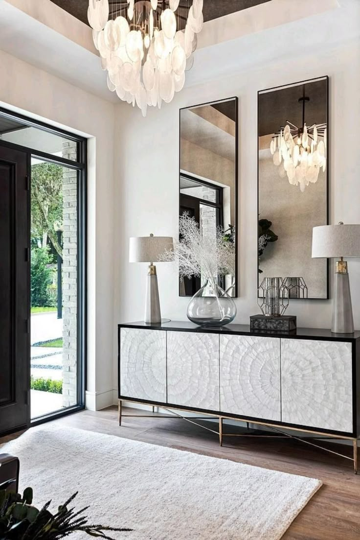 Luxury entryway with console table and sculptural mirror